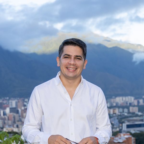 Christian Solitario in Caracas, with the Ávila mountain behind him